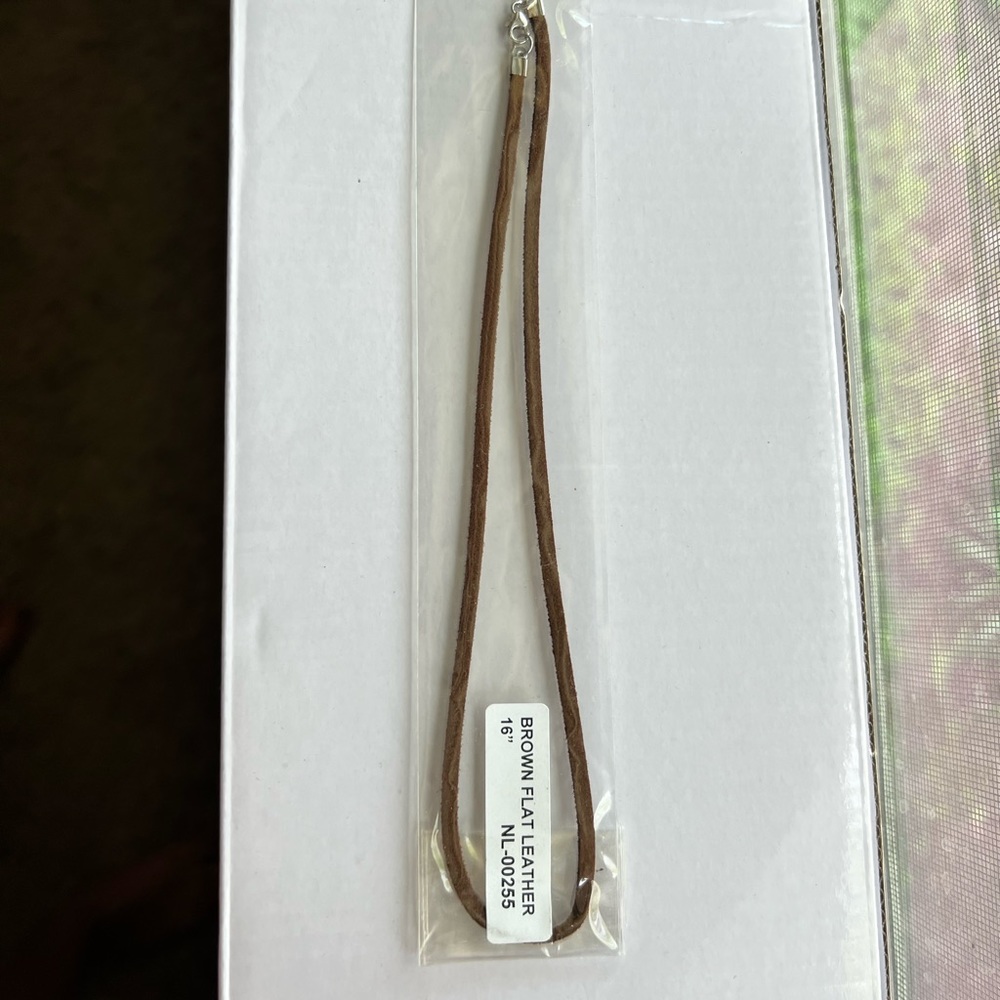Brown leather necklace cord.